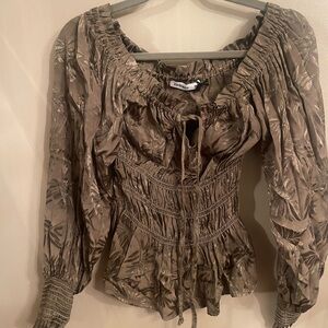 Really nice silky material top can be worn off the shoulder or on